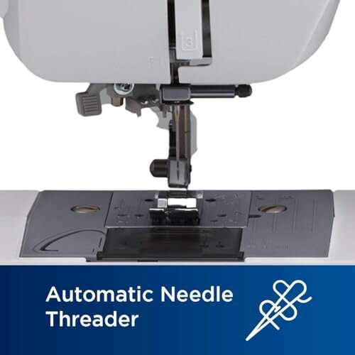 Close-up of an automatic needle threader on a sewing machine.