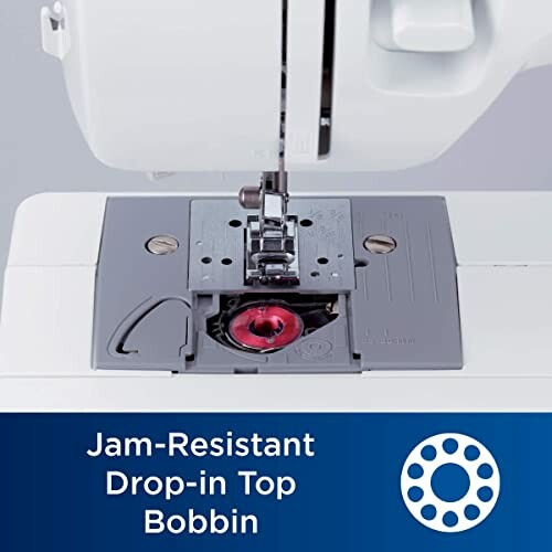 Close-up of a sewing machine with a jam-resistant drop-in top bobbin.